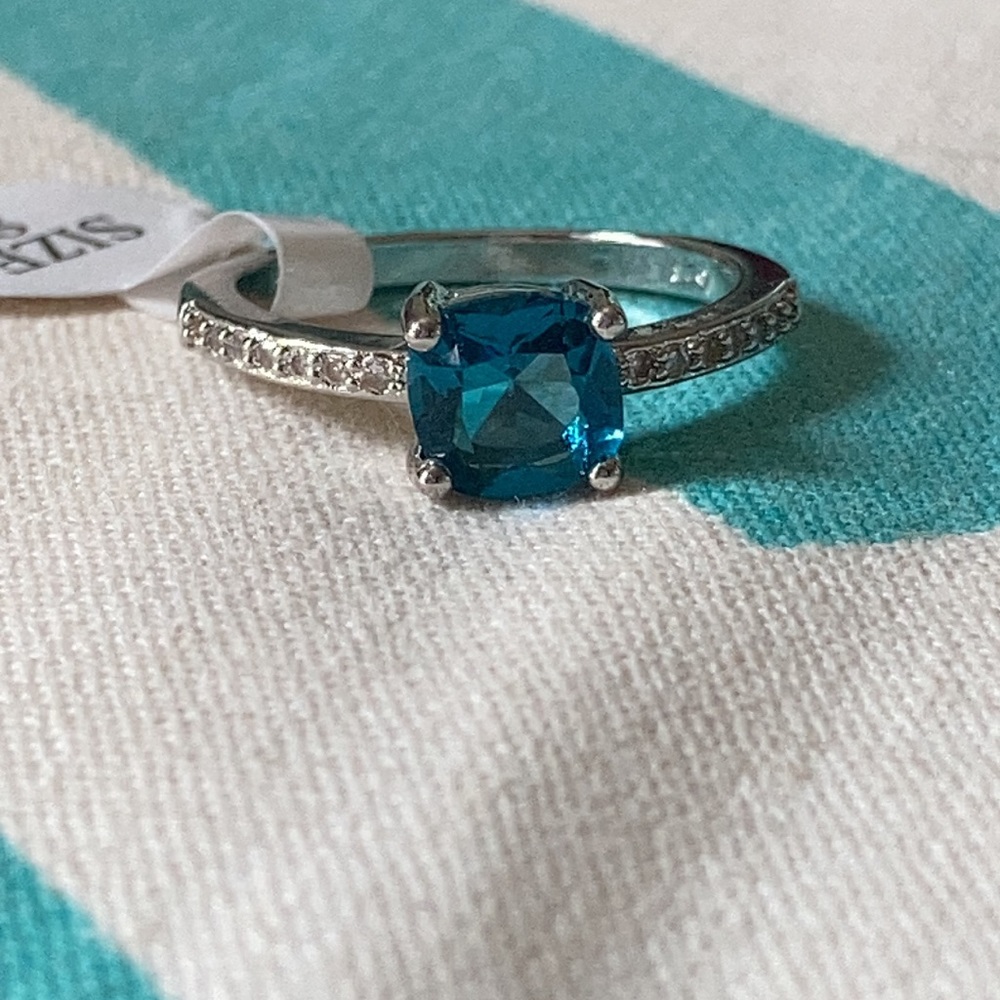 Blue cushion cut ring in silver